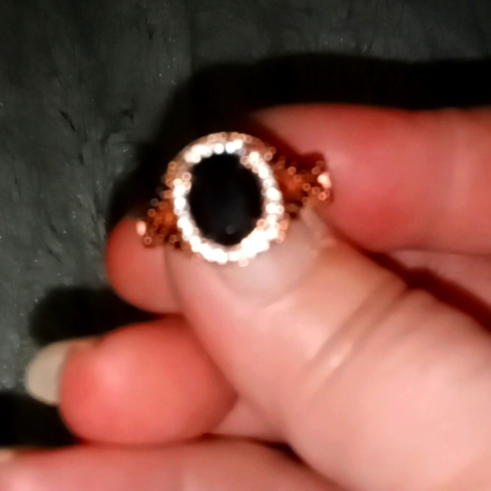 Rose gold plated over S925 with a black onyx in the middle and on the sides.